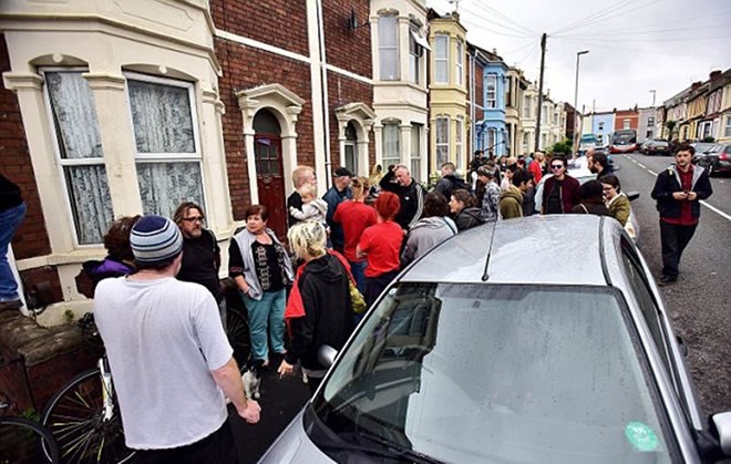 Around 30 people stood side-by-side, arms linked, in front of the property in Easton, Bristol