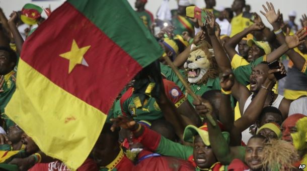 FILE - Cameroon supporters chants ahead of soccer match against Guinea Bissau during the African Cup of Nations Group A soccer match between Cameroon and Guinea Bissau at the Stade de l'Amitie, in Libreville, Gabon, Jan. 18, 2017.