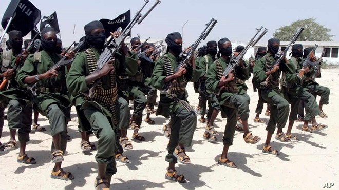 Hundreds of newly trained al-Shabab fighters perform military exercises in the Lafofe area some 18 km south of Mogadishu, in Somalia, Feb. 17, 2011.