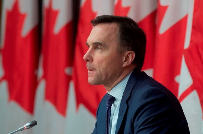 Minister of Finance Bill Morneau responds to a question during a news conference in Ottawa, Friday, March 27, 2020. THE CANADIAN PRESS/Adrian Wyld