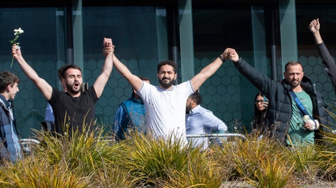 Mosque shooting survivors from left, Mustafa Boztas, Wassail Daragmih and Temel Atacocugu celebrate as they leave the Christchurch High Court after the sentencing hearing for Brenton Tarrant, in Christchurch, New Zealand [Mark Baker/ AP]