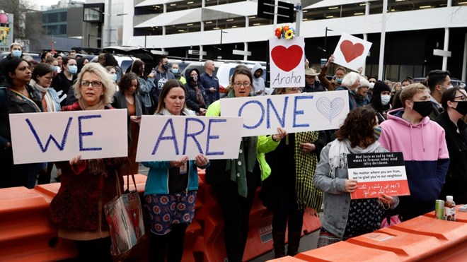 Supporters of the mosque shooting victims sing outside the Christchurch High Court during the sentencing hearing for Brenton Tarrant [Mark Baker/ AP]