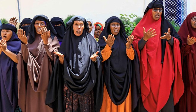 Somali women whose sons are missing after they were taken for military training, pray after a Reuters interview in Mogadishu, Somalia January 20, 2021. REUTERS/Feisal Omar