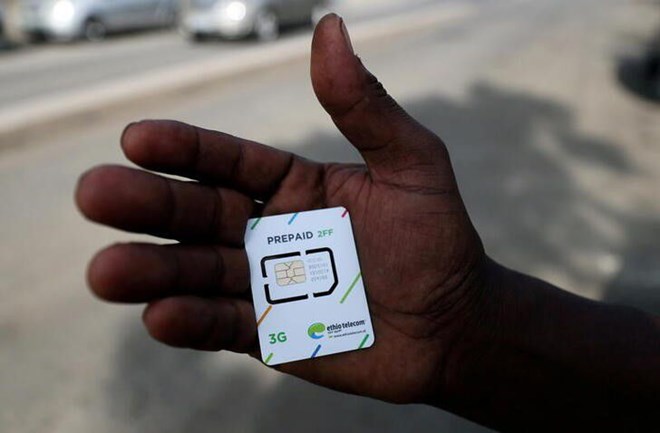 A customer holds a 3G prepaid sim card after buying the service from an Ethio-Telecom shop in Addis Ababa, Ethiopia, November 12, 2019. REUTERS/Tiksa Negeri/File Photo
