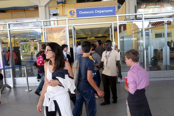 Some of the passengers who were on board the Air France plane at the Moi International Airport as they wait for a new plane to travel to Paris on December 20, 2015.
