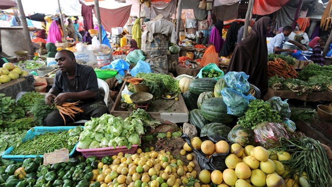 Somali traders at markets like this one in Mogadishu are increasingly more likely to do business using cellphones instead of cash. (Reuters/Feisal Omar)