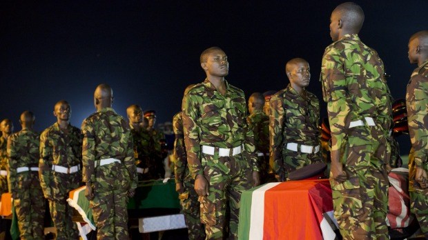 Military pallbearers stand to attention in Nairobi on Monday next to the coffins of four Kenyan soldiers who were killed in Somalia. Photo: AP