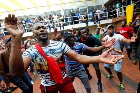 University of Cape Town (UCT) students sing during protests demanding free tertiary education in Cape Town, South Africa, October 5, 2016.