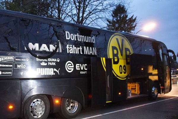 Borussia Dortmund's damaged bus is pictured after an explosion some 10km away from the stadium prior to the UEFA Champions League game in western Germany on April 11, 2017. PHOTO | PATRIK STOLLARZ | AFP