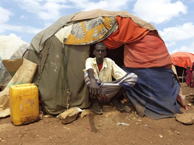 Hussein Ali Isaak, 40, Dusta IDP camp. Hussein lives with his wife and five children, Hussein took out a loan from neighbours to take his family to the camp, to pay food and medicines for his children. He lost his sixth son, Mohamed, to cholera in the cam