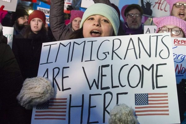 Demonstrators protest against US President Donald Trump and his administration's ban of travellers from seven countries by Executive Order, during a rally outside the US Supreme Court in Washington, DC, on January 30, 2017. Some illegal migrants have already been deported to Mexico. PHOTO | AFP