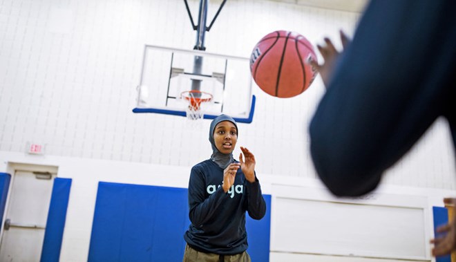 Nabhaii Farah, 12, wearing an Asiya sport hijab at the Brian Coyle community center in Minneapolis. Asiya’s founder, Fatimah Hussein, said that as a child she was preoccupied with thoughts of “this doesn’t look right, this is falling.”