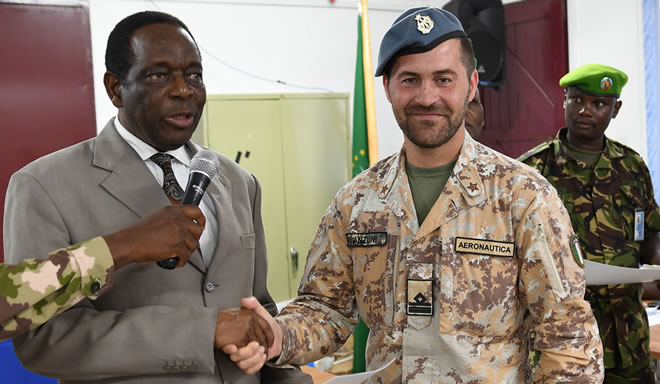 Ambassador Francisco Madeira, the Special Representative of the Chairperson of the African Union Commission (SRCC) for Somalia, presents a certificate to an EUTM officer during the closing session of a two-day seminar on Countering Improvised Explosive Devices (CIEDs) in Mogadishu, Somalia, on 17 April 2018. AMISOM Photo / Omar Abdisalan