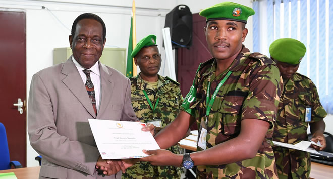 Ambassador Francisco Madeira, the Special Representative of the Chairperson of the African Union Commission (SRCC) for Somalia, presents a certificate to an AMISOM military officer during the closing session of a two-day seminar on Countering Improvised Explosive Devices (CIEDs) in Mogadishu, Somalia, on 17 April 2018. AMISOM Photo / Omar Abdisalan