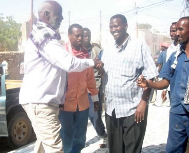 The photo depicts the National Security Minister Omar Hashi Aden, and the Somalia Ambassador to Ethiopia Abdikarim Farah Laqanyo, greeting local representatives in Beledweyne- the last picture before the assassination